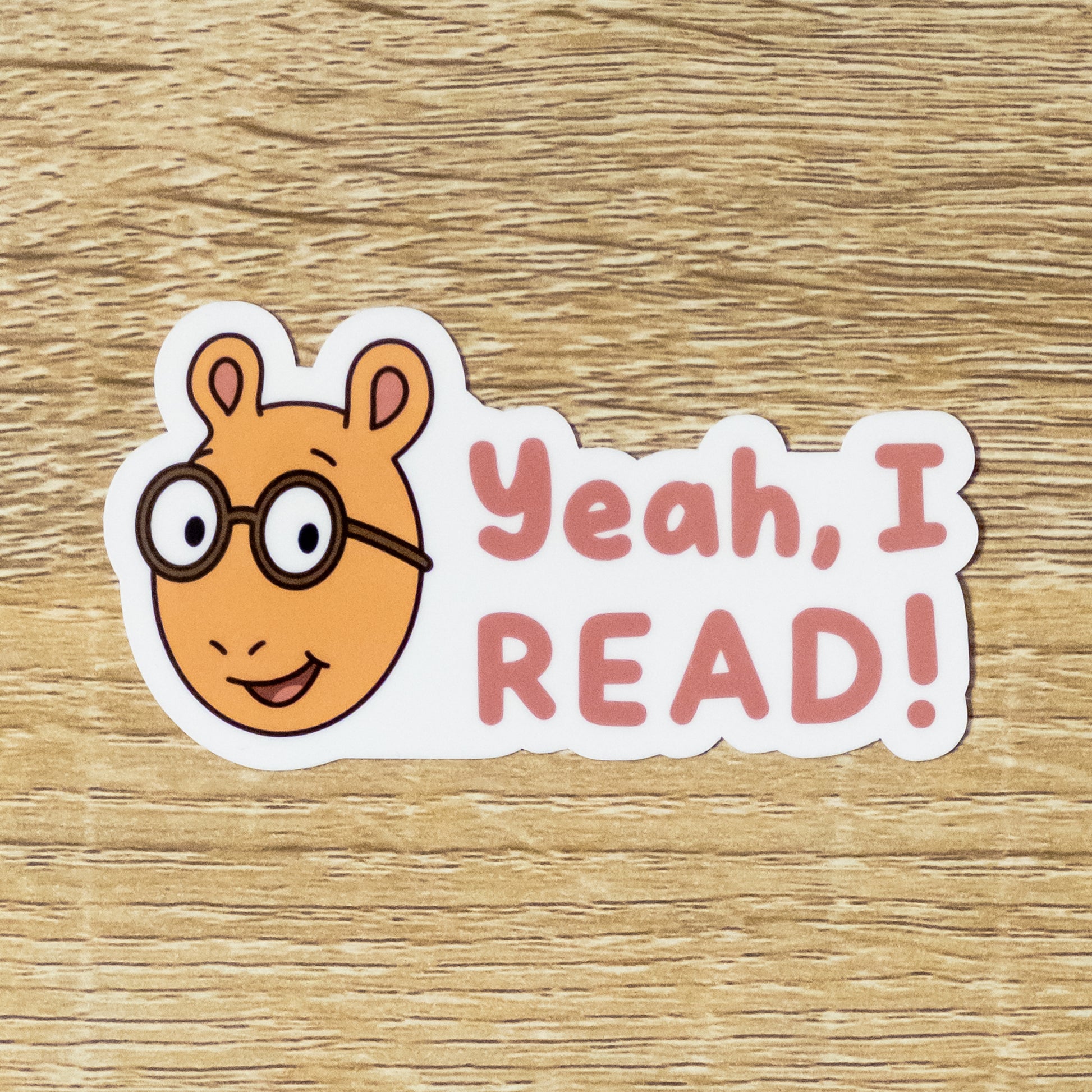 Glossy 3.3 inch wide sticker. Design is Arthur Read with the text, "Yeah, I READ!" Inspired by Athur the Aardvark from PBS Kids.