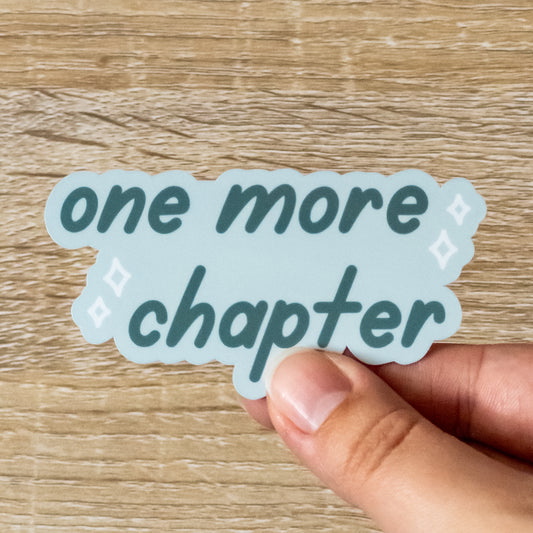 Glossy 3.3 inch wide sticker. Design is a pale blue background with light blue sparkles, and dark blue text that says, "One More Chapter"